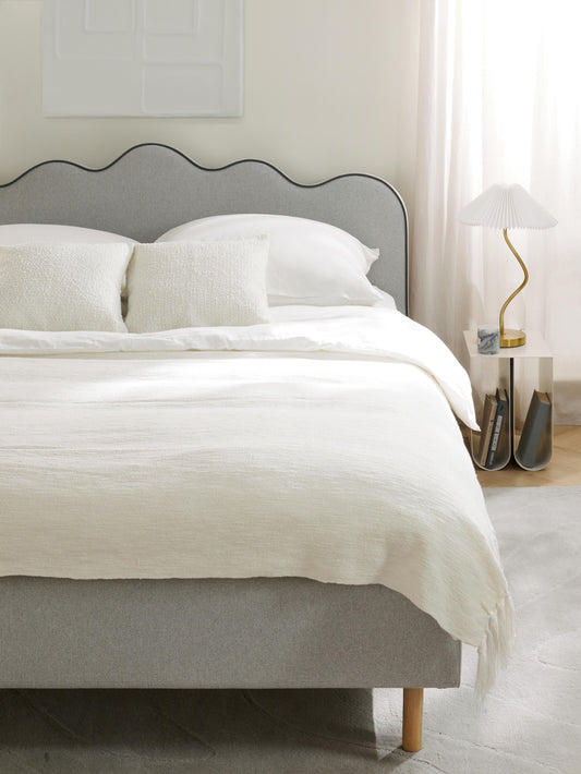 Romyra Upholstered Bed with Wavy Headboard