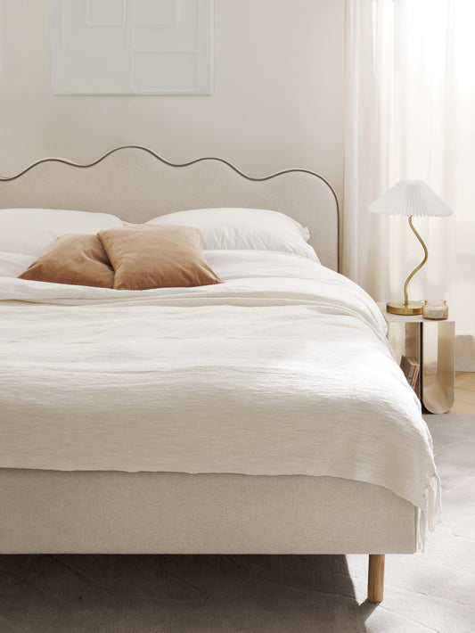 Romyra Upholstered Bed with Wavy Headboard