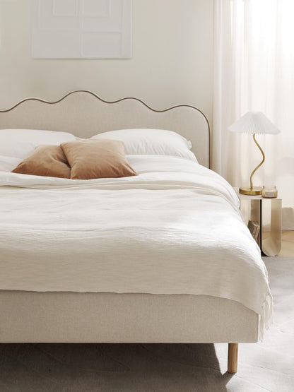 Romyra Upholstered Bed with Wavy Headboard